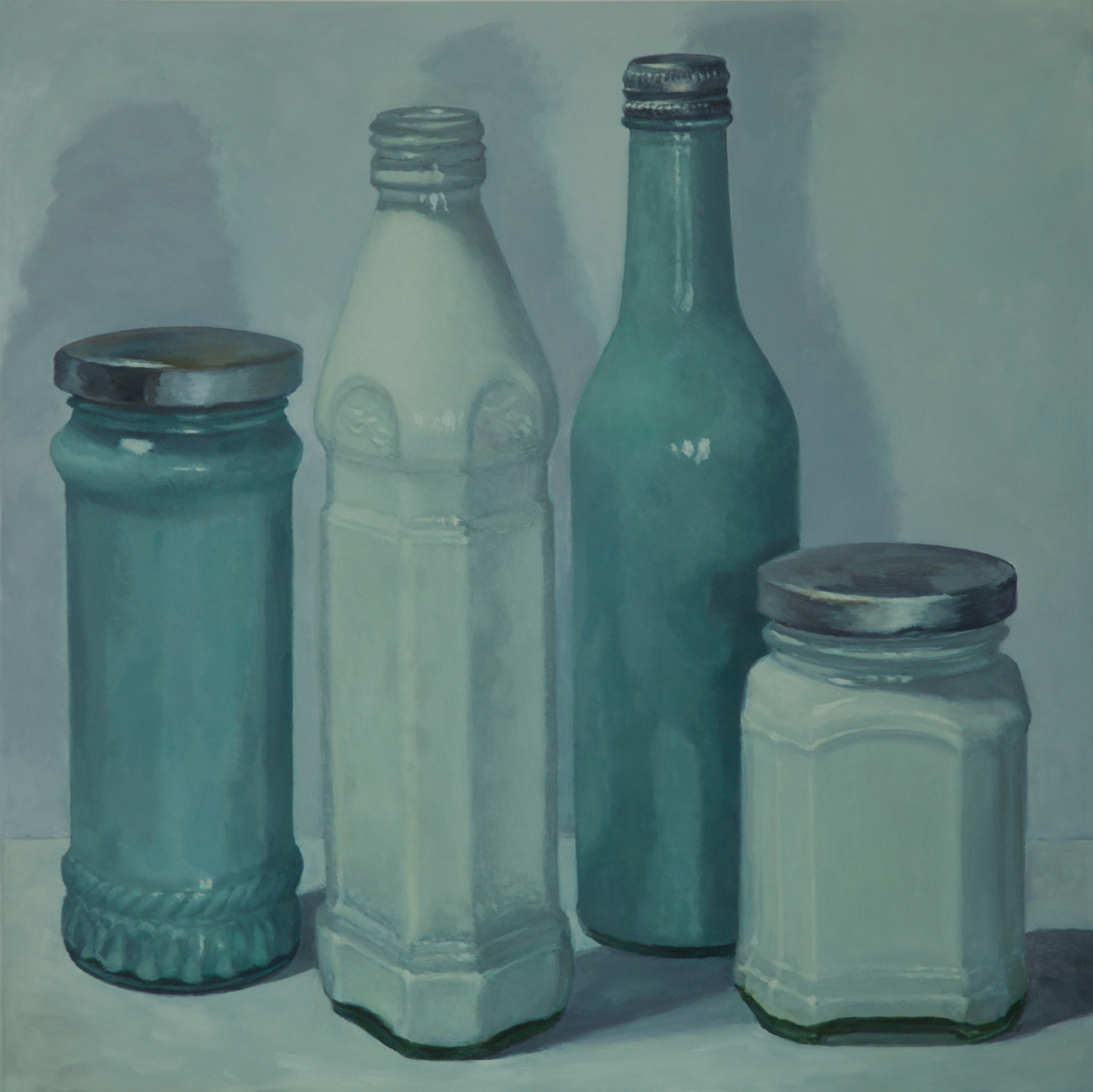 green and white milk jars with tin lids