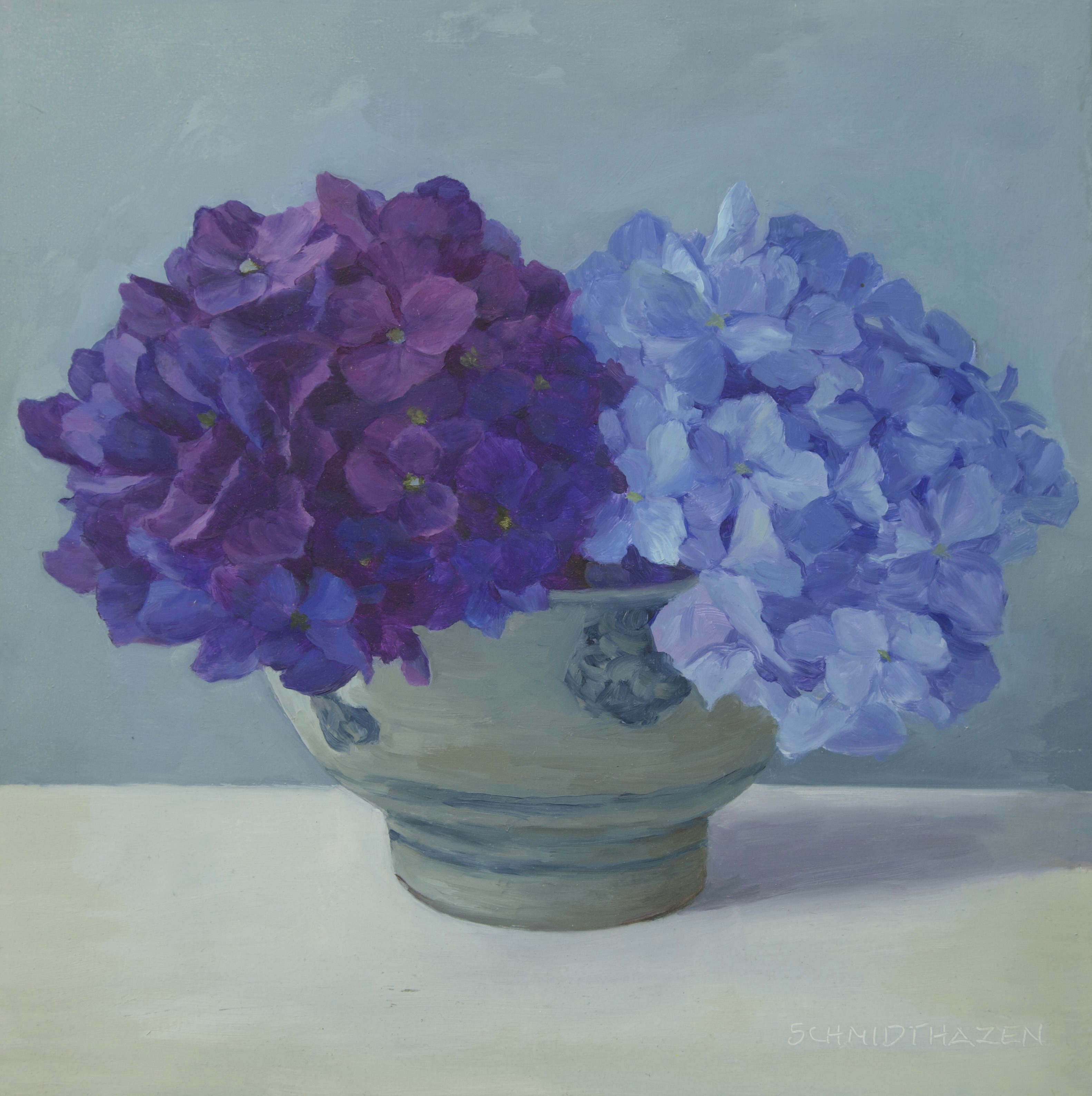 Two hydrangeas purple and blue in beige and dark blue Bali bowl