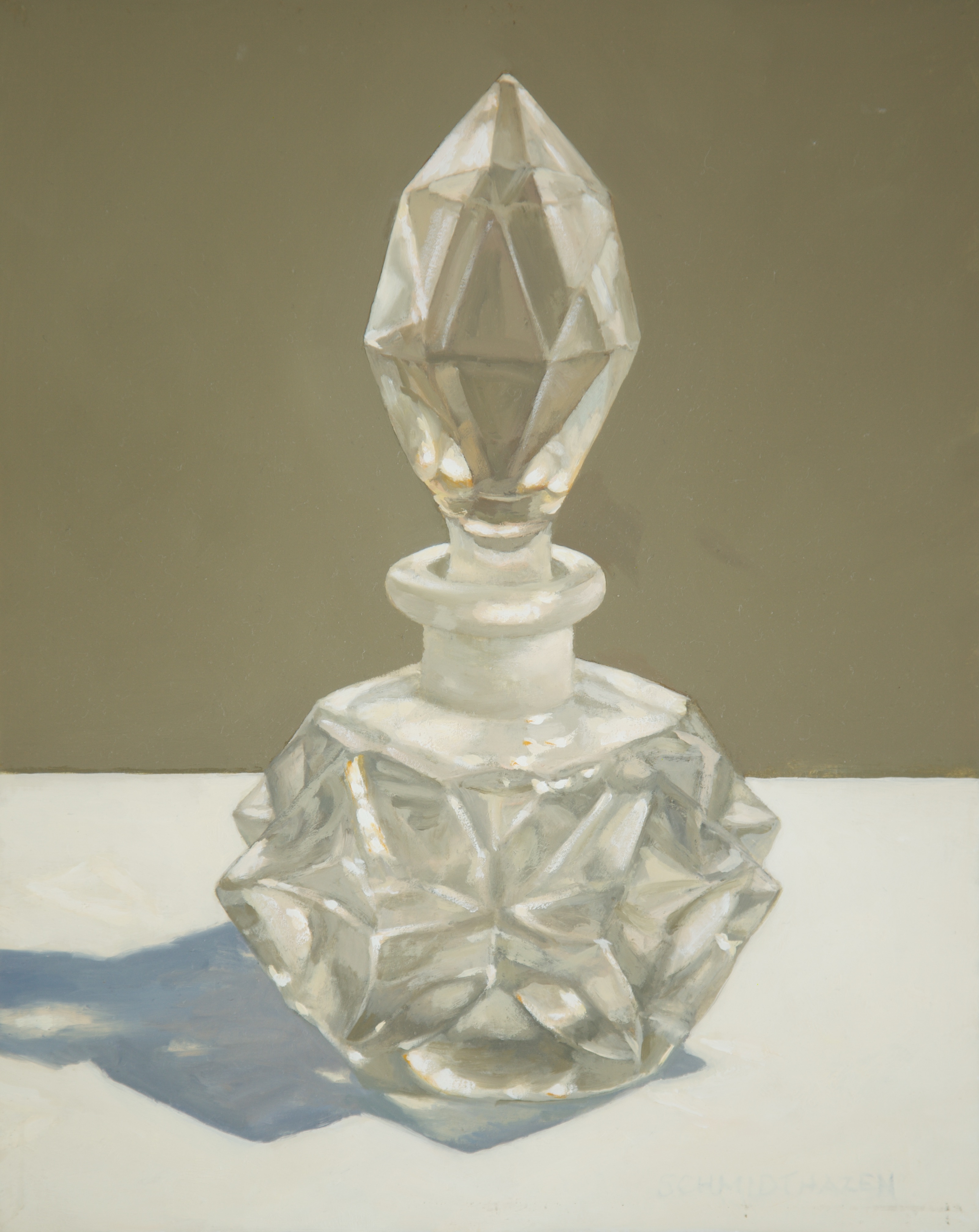 Glass perfume bottle cream and beige background