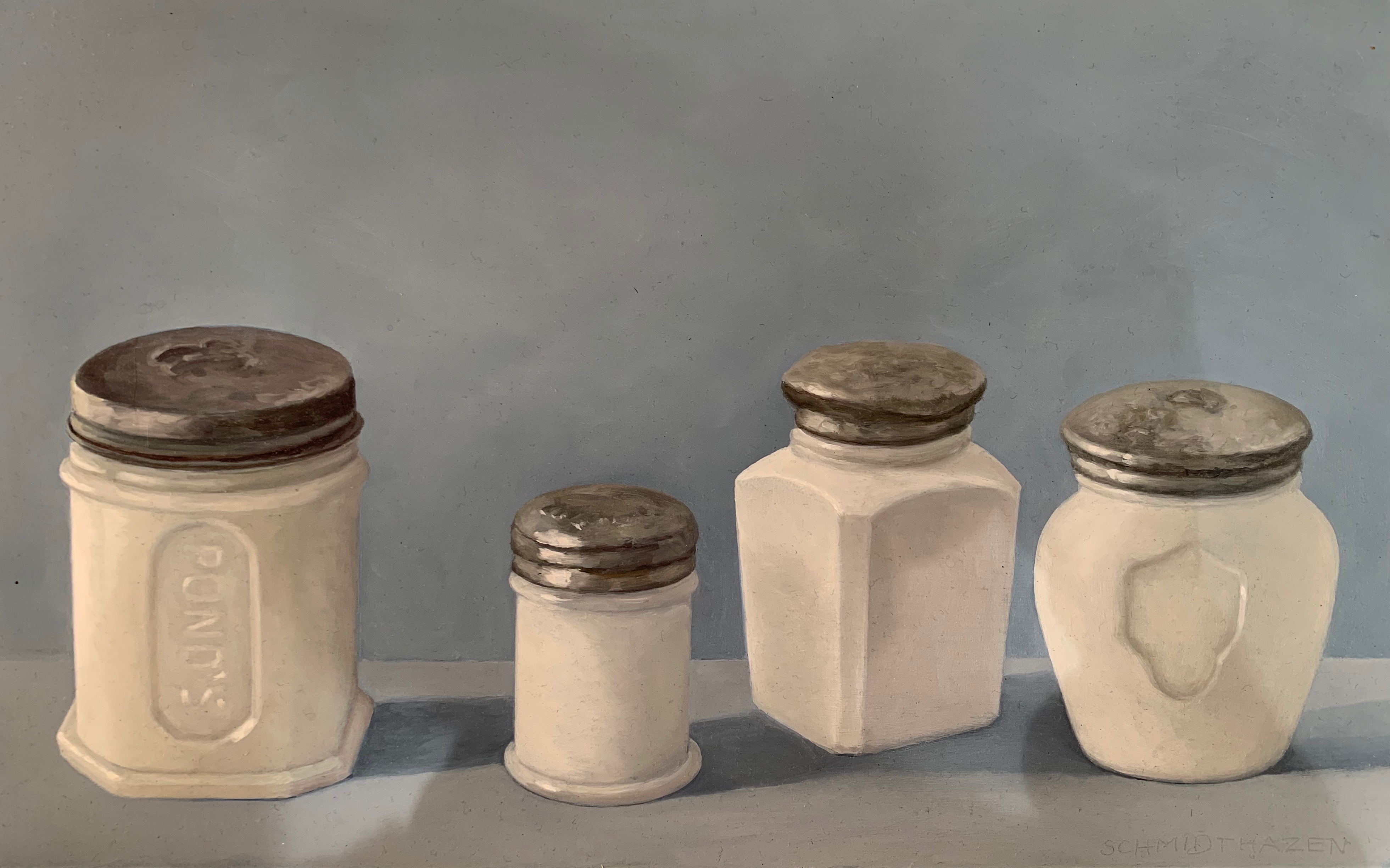 4 white glass jars with silver lids